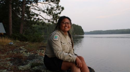 staff sitting on edge of shore